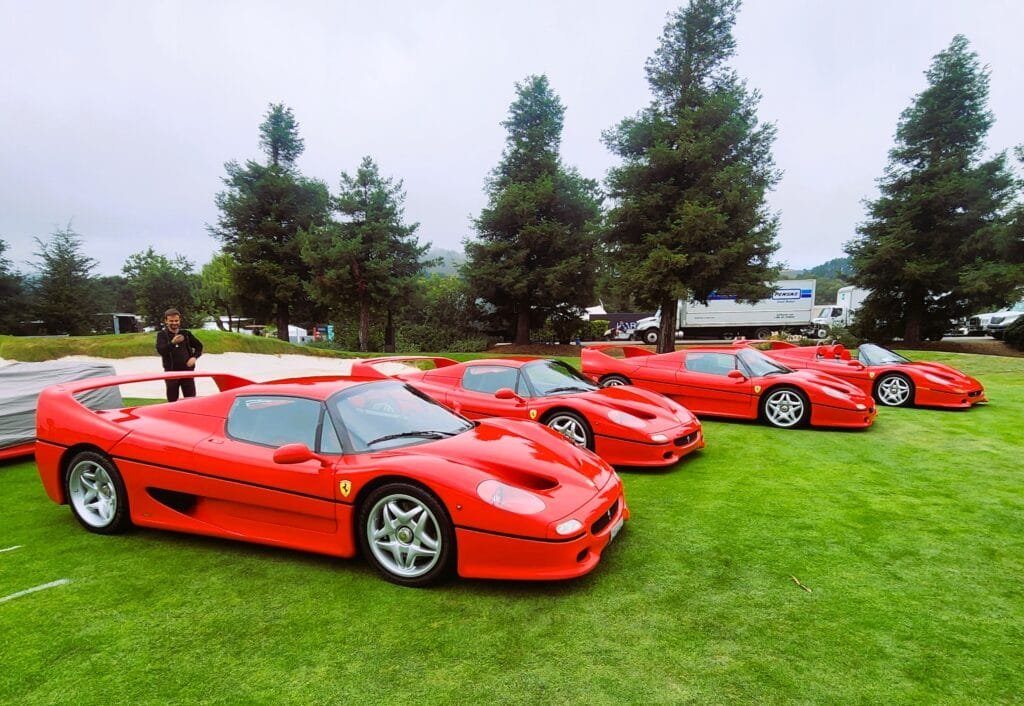 Ferrari F50 lineup at an outdoor car show display
